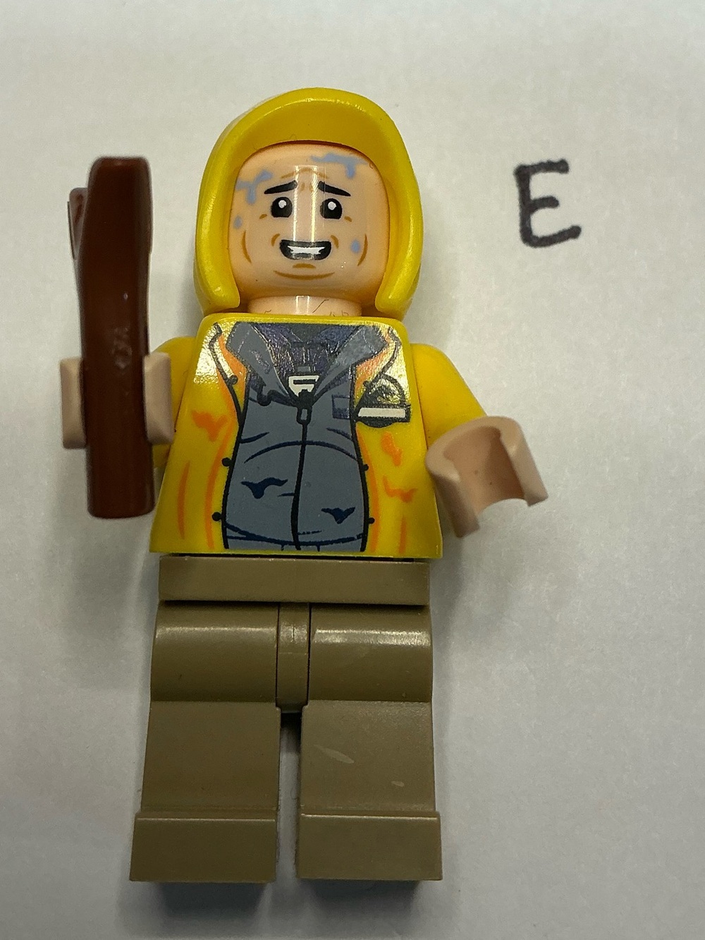 LEGO Dennis Nedry minifigure with a yellow hood and raincoat